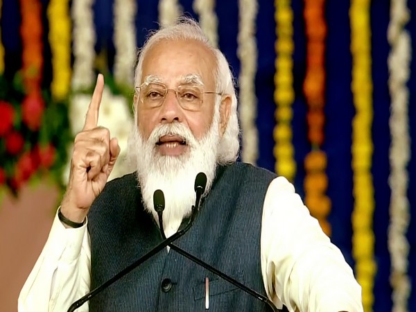 Prime Minister Narendra Modi addresses as he attends the foundation stone laying ceremony