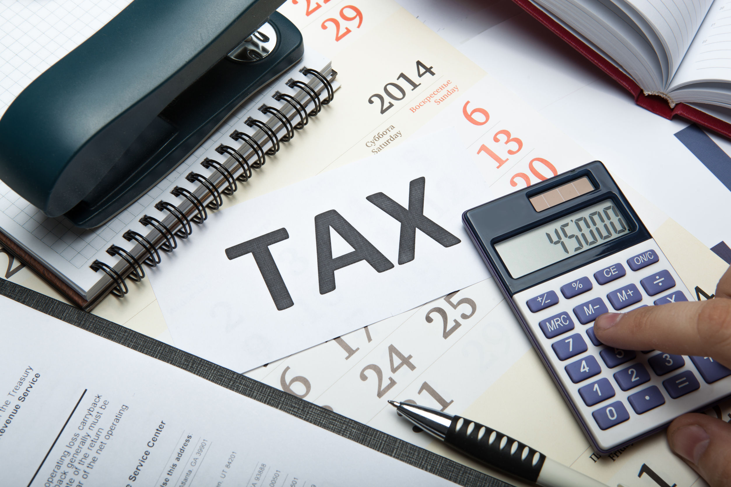 44968867 – office work and filling in tax returns close up