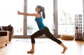 A woman doing a full-body workout at home