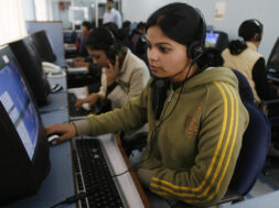 Employees at call centre provide service support to customers in the northeastern Indian city of Siliguri