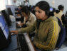 Employees at call centre provide service support to customers in the northeastern Indian city of Siliguri