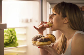 Young woman having a midnight snack