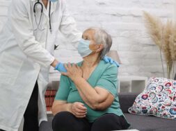 Medical worker use stethoscope to examine pulse rate on senior patient. Health care check up.