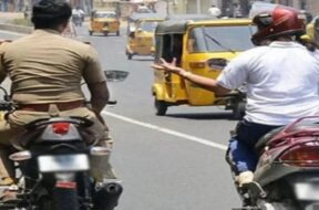 policeman driving without helmet (2)