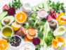 Five best vitamins for beautiful skin. Products with vitamins A, B, C, E, K – broccoli, sweet potatoes, orange, avocado, spinach, peppers, olive oil, dairy, beets, cucumber, beens. Flat lay, top view