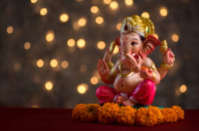 Hindu,God,Ganesha,On,Blured,Bokhe,Background,,Ganesha,Idol.