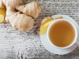 ginger-tea-in-a-white-cup-on-wooden-background-royalty-free-image-492223016-1547048096
