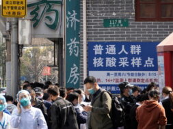 FILE PHOTO: Residents line up outside a nucleic acid testing site of a hospital in Shanghai