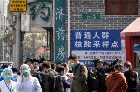 FILE PHOTO: Residents line up outside a nucleic acid testing site of a hospital in Shanghai