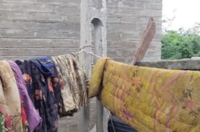 CLOTHES DRYING ON IRON WIRE