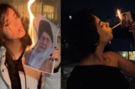 Women light cigarettes with burning posters of Khamenei