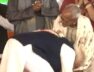 PM Modi touches feet of Makhanlal Sarkar on stage in Kolkata
