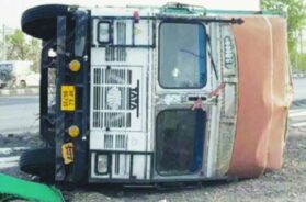 Storm, overturns truck