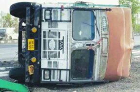 Storm, overturns truck